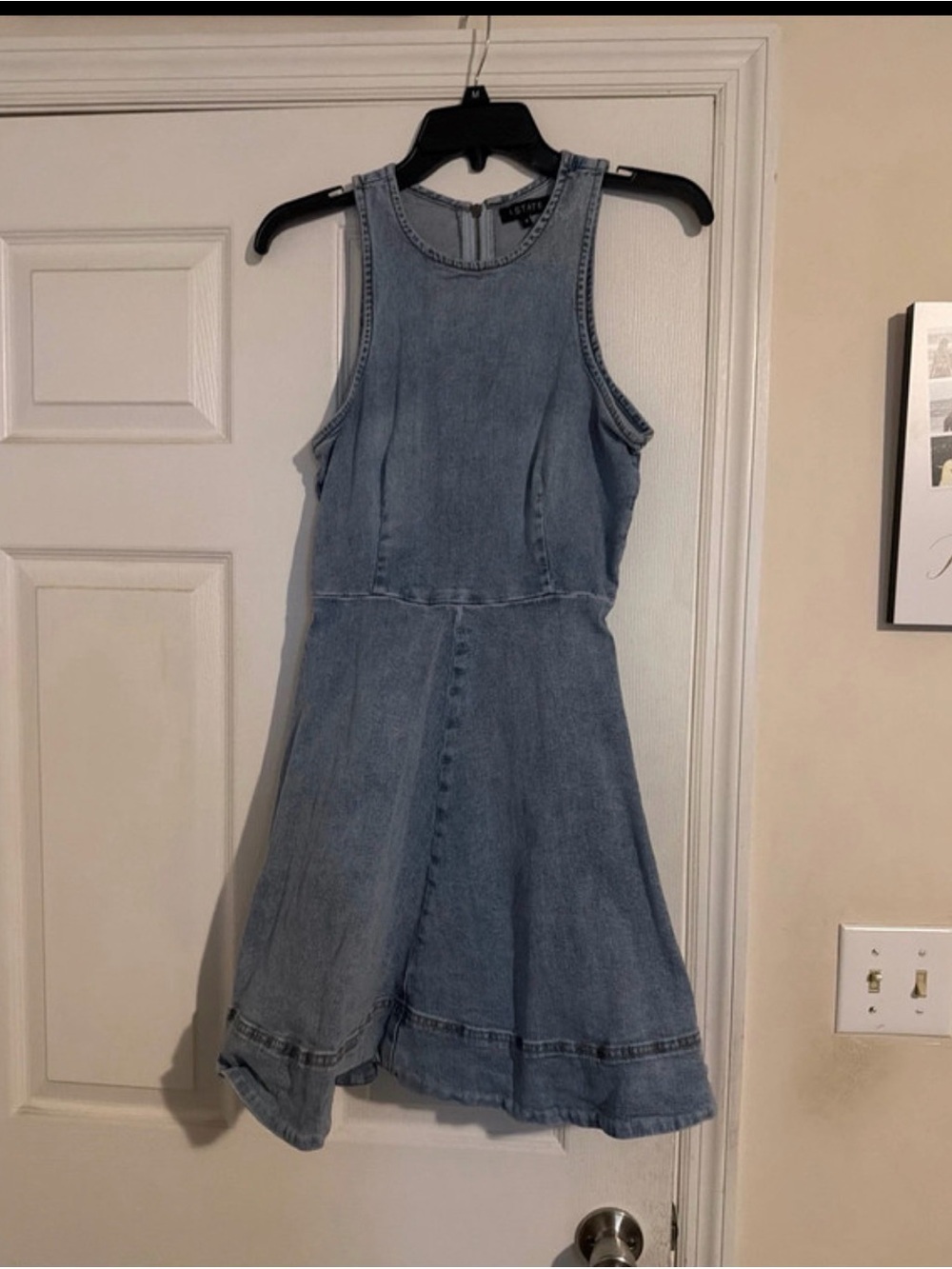 Denim garment neckline with brand label